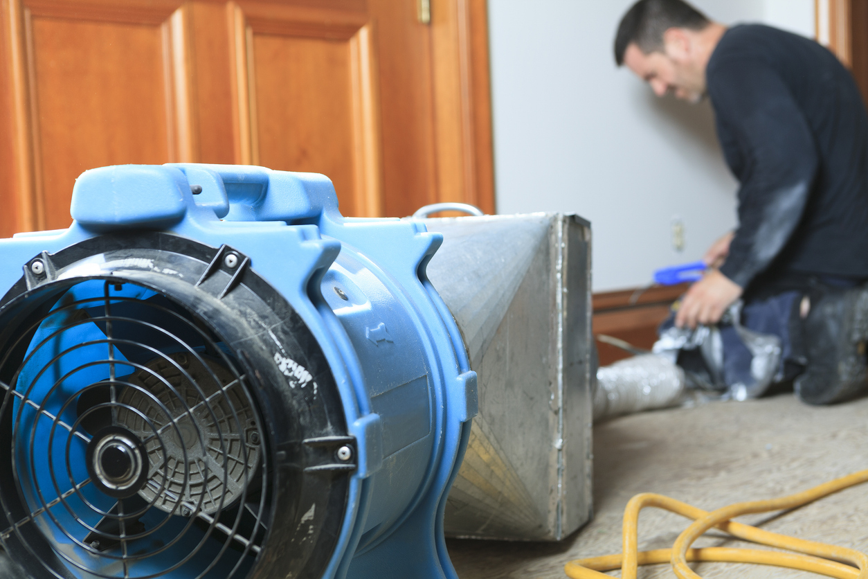 1st Choice Restoration technician working on a damaged Menifee property